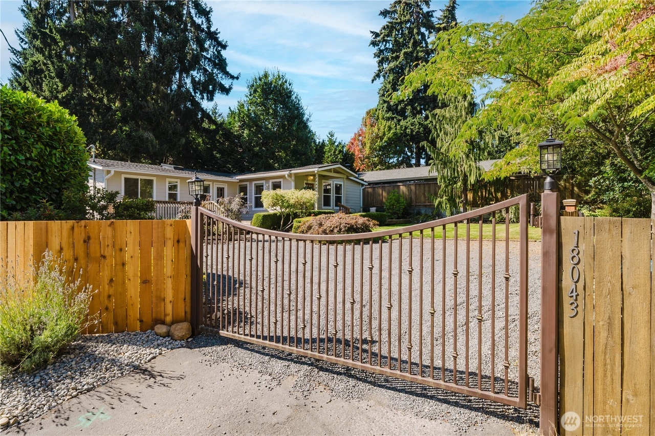 Gated entrance to the long tree-lined driveway